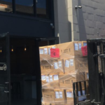 A pallet of wine on a forklift